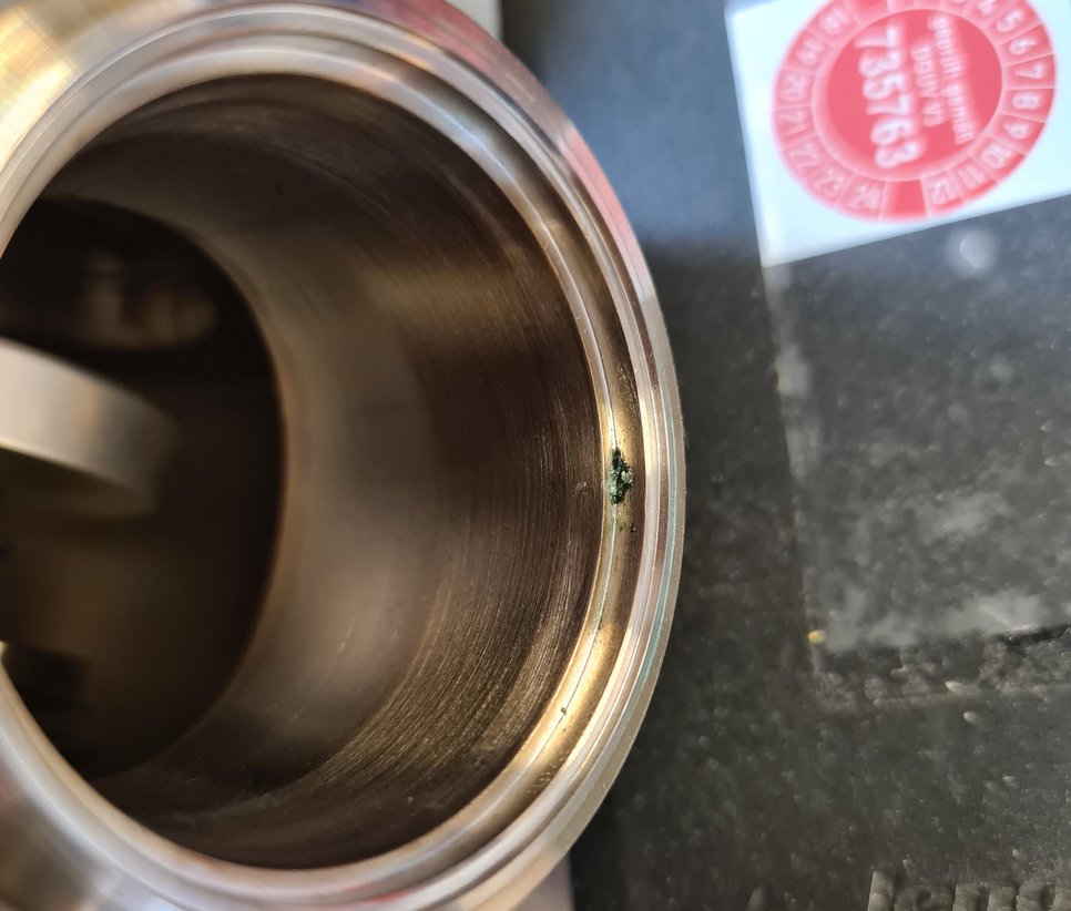 Leak in one of the flanges before repair (near image center).