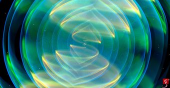Dance of the heavyweights: two neutron stars orbit each other, spiralling ever closer together, radiating gravitational waves in the process. This image of the real event GW170817 comes from a numerical-relativistic simulation. Visualization of gravitational waves emitted by the merger of two neutron stars. Green, yellow, and blue transparent spherical waves around two white points.