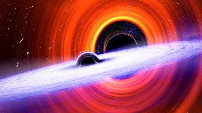 Artist’s impression of two coalescing black holes. Illustration of two black holes, one smaller than the other. Each is surrounded by a glowing accretion disk. The disks are tilted relative to each other.