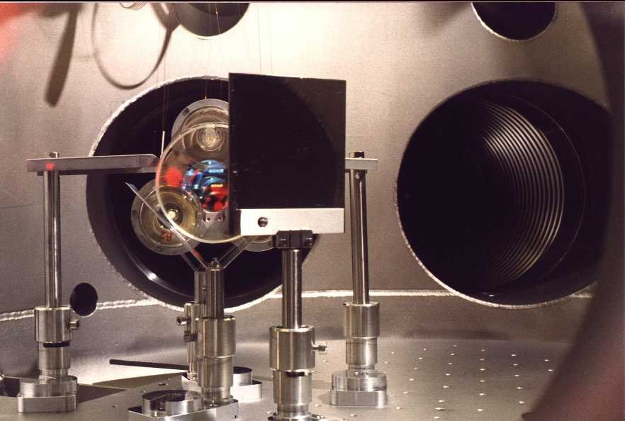 A look through the camera viewport: In front the stainless steel mirror, then mirror MMC2b, behind it the reaction mass with coils; in the back the modecleaner tubes.