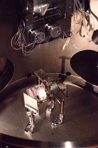 A view from SSW. The thin (50 µm) copper wires are the electricity supply for the coils of the reaction mass. A view from SSW. The thin (50 µm) copper wires are the electricity supply for the coils of the reaction mass.