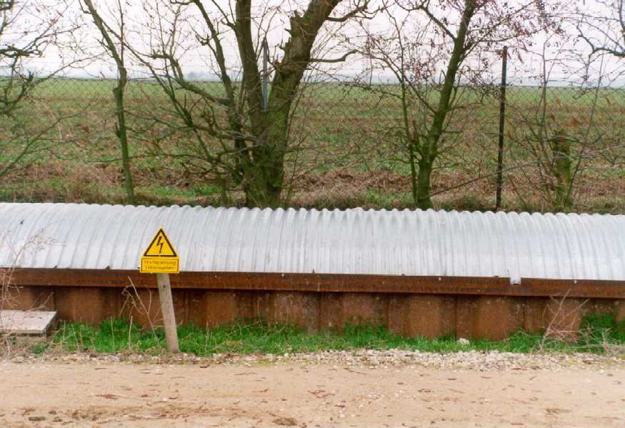 Part of the covered trench with warning. During the period of heating a current of 600 A flows through the tube.