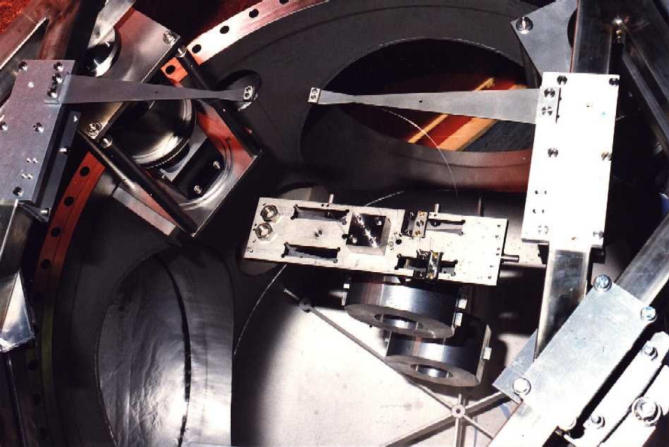 The triple pendulum: cantilever springs, upper mass, intermediate mass and test mass dummy.