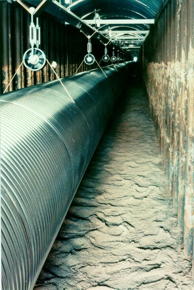 A look at the tube in the trench. You can see the suspension of the tube and the light at the endof the tunnel.