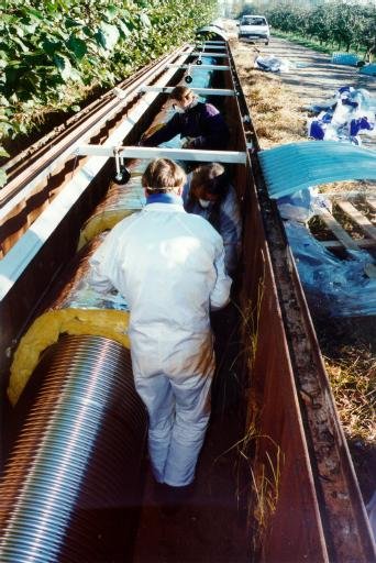 A look into the trench: The tube has been partly wrapped up.