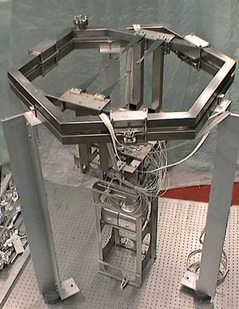 Suspension for TCE mirror, preassembled on an optical bench. Suspension for TCE mirror, preassembled on an optical bench.