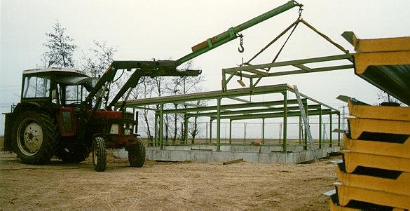 The builders have to use the most sophisticated and modern equipment in their struggle to get the building closed before they are frozen to the ground.  At this time of the day it is -8°C and a freezing eastern wind.
