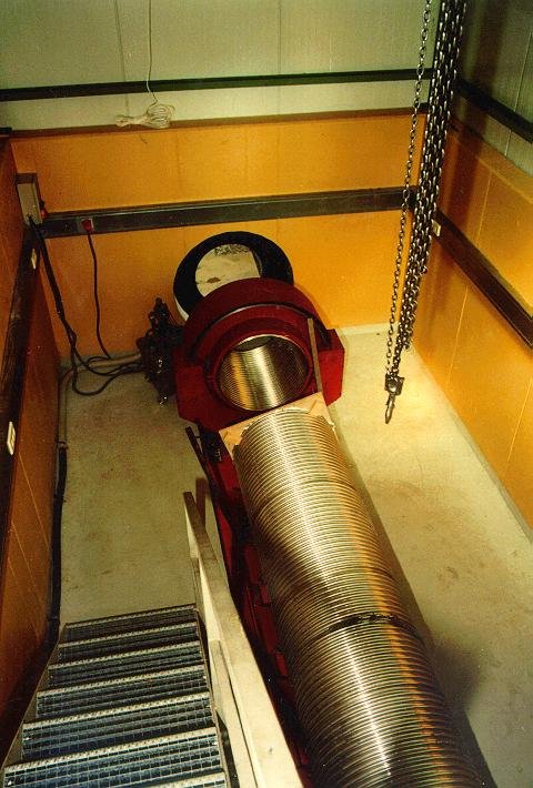 Inside the eastern end house. You can see the welding machine (red) with a short test segment of tube in front of the port in the wall leading to the trench (with the black seal to keep the building dust tight when welding the tube) and another tube section to see whether everything fits together. During the welding process the building will be slightly pressurized to prevent dust entering the building. An air lock allows to enter the building.