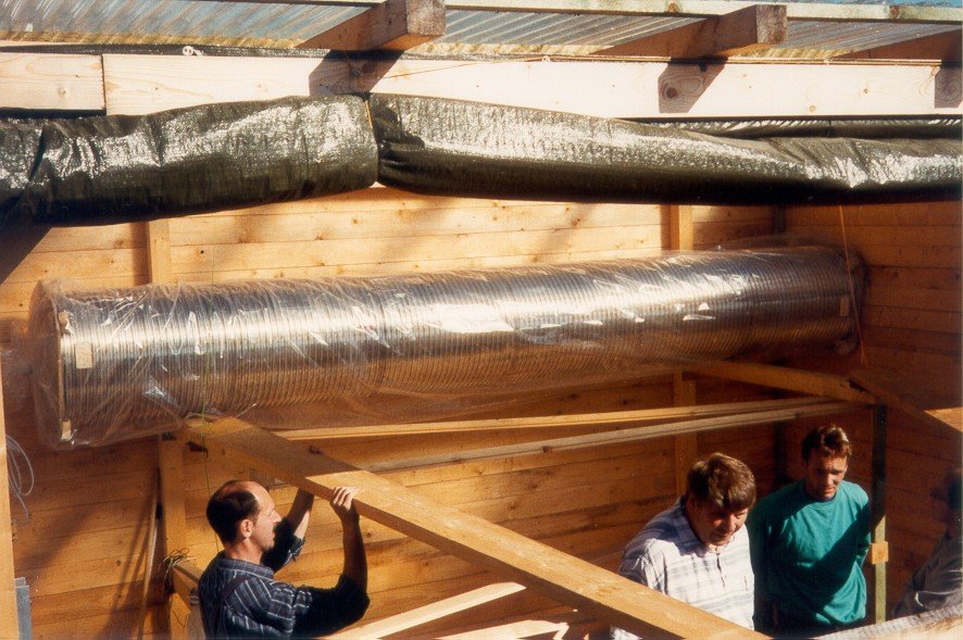 The tubes are stored within the wooden hut.