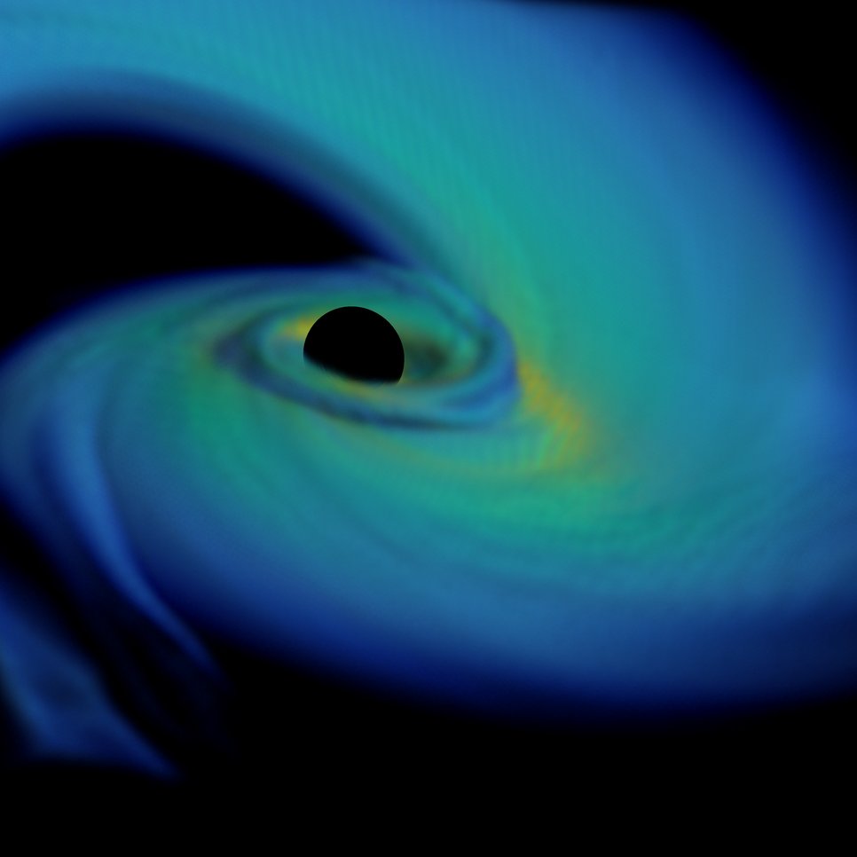 Merger of a neutron star with a black hole of about 5 times the mass of the sun. The black hole’s gravitational field stretches and eventually disrupts the neutron star. 90% of the neutron star matter falls into the black hole within 1 millisecond, while the rest is ejected in a long tail, or forms a hot torus of dense matter around the black hole. The figure shows the black hole (black sphere), tail and torus a few milliseconds after disruption.